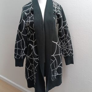 Elegant Black Cardigan with White Web Design